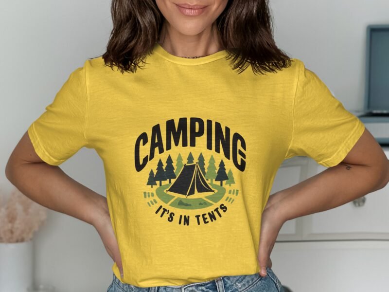 A woman models a yellow t-shirt with "CAMPING IT'S IN TENTS" and a graphic of a tent and trees.