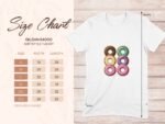 A white t-shirt with a graphic of five colorful donuts alongside a size chart for Gildan 64000 Softstyle T-shirt.