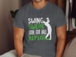 A man wearing a gray t-shirt with a golfer graphic and the text: "SWING, SWEAR, LOOK FOR BALL, REPEAT."