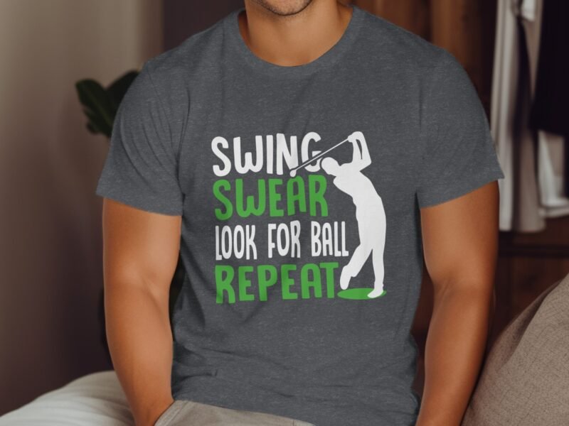 A man wearing a gray t-shirt with a golfer graphic and the text: "SWING, SWEAR, LOOK FOR BALL, REPEAT."
