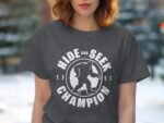Woman wearing a gray t-shirt with "Hide and Seek Champion" text and a Bigfoot graphic, set against a blurred background.