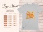 Gray T-shirt with a floral pumpkin graphic; size chart lists dimensions for S-3XL in inches.