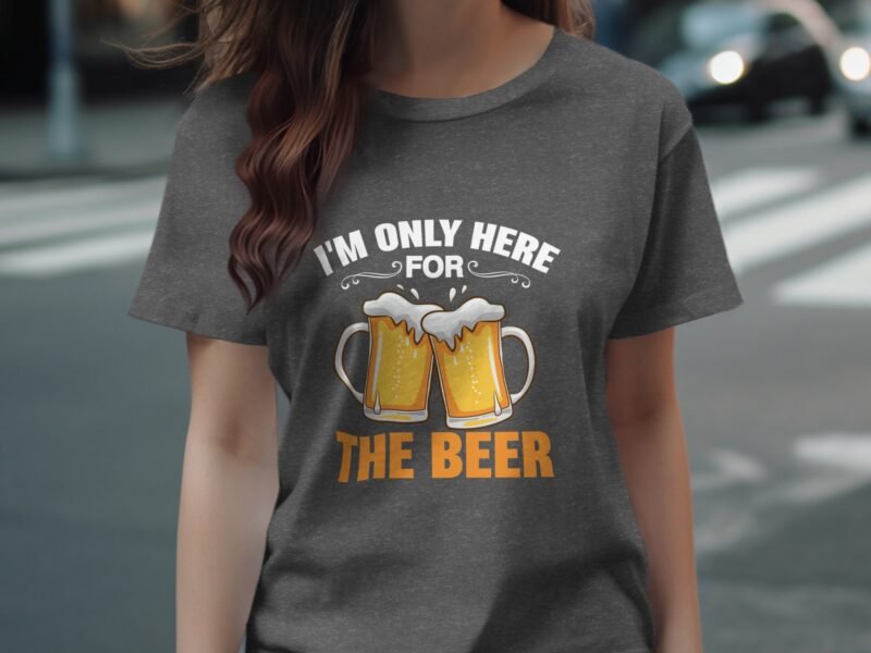 Woman wearing a gray t-shirt with a graphic of two beer mugs and the text "I'm only here for THE BEER."
