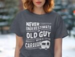 A woman wearing a gray t-shirt with the phrase "Never underestimate an old guy with a caravan" and a caravan graphic.