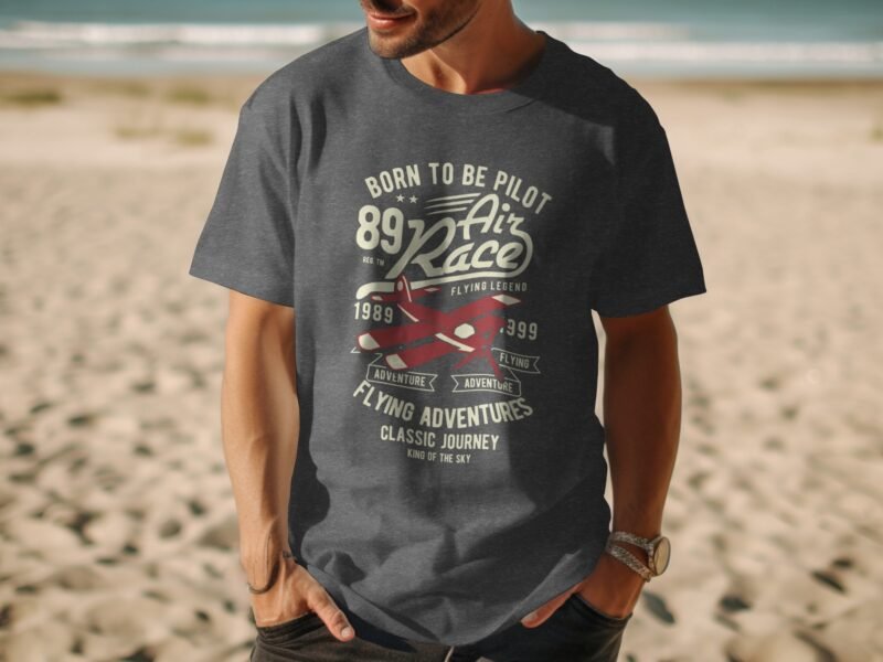 A man wearing a dark gray t-shirt with a graphic design about flying, featuring planes and text related to air racing.
