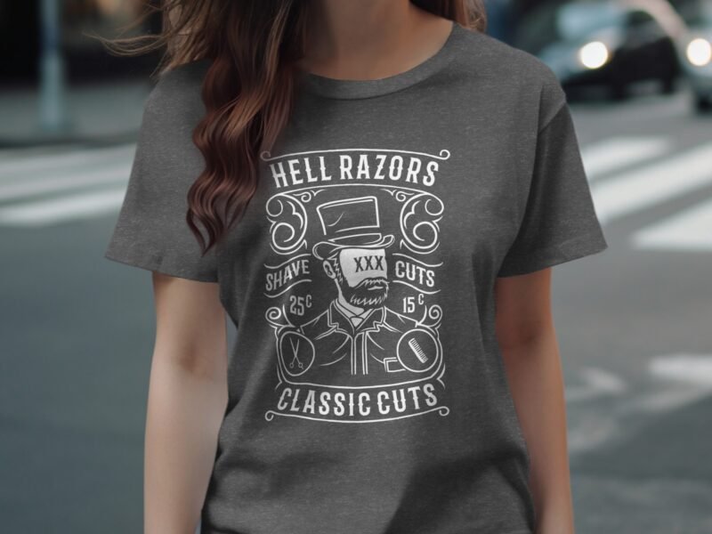A woman in a gray shirt features a vintage barber design with "Hell Razors," a bearded man, and haircut prices.