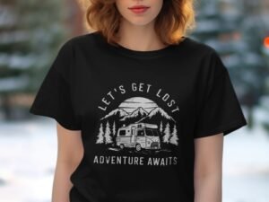 Woman wearing a black t-shirt with "Let's Get Lost Adventure Awaits" design featuring mountains and an RV.