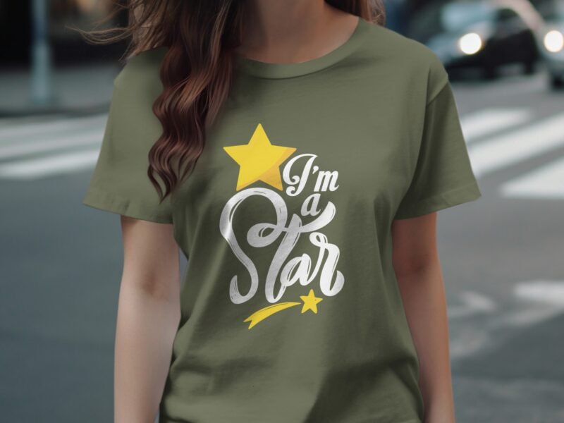 A person wearing an olive green t-shirt with the text "I'm a Star" and a yellow star graphic.