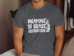 A man wearing a gray t-shirt with the phrase "WEAPONS OF GRASS DESTRUCTION" and a golf bag illustration.